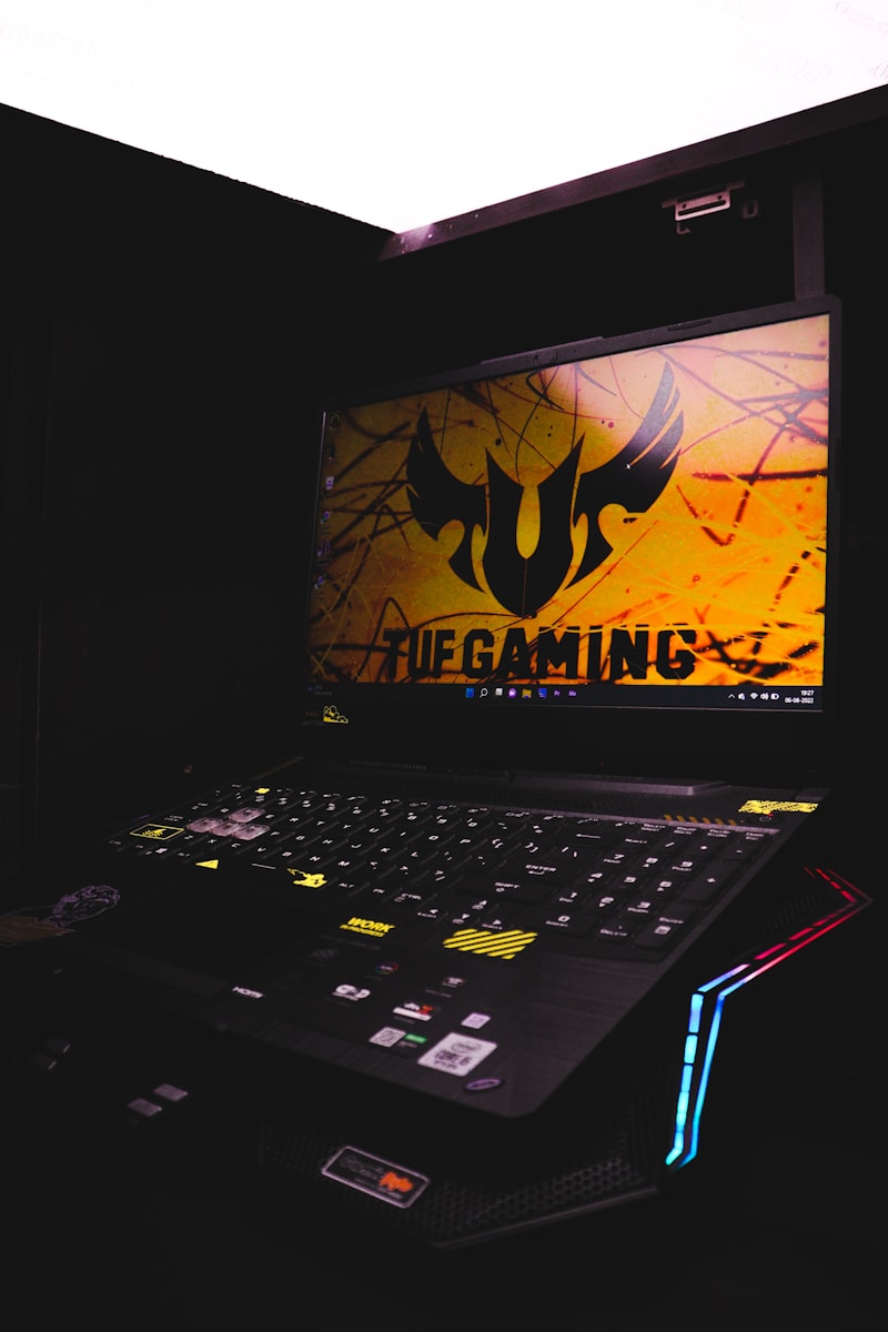 a laptop computer sitting on top of a desk