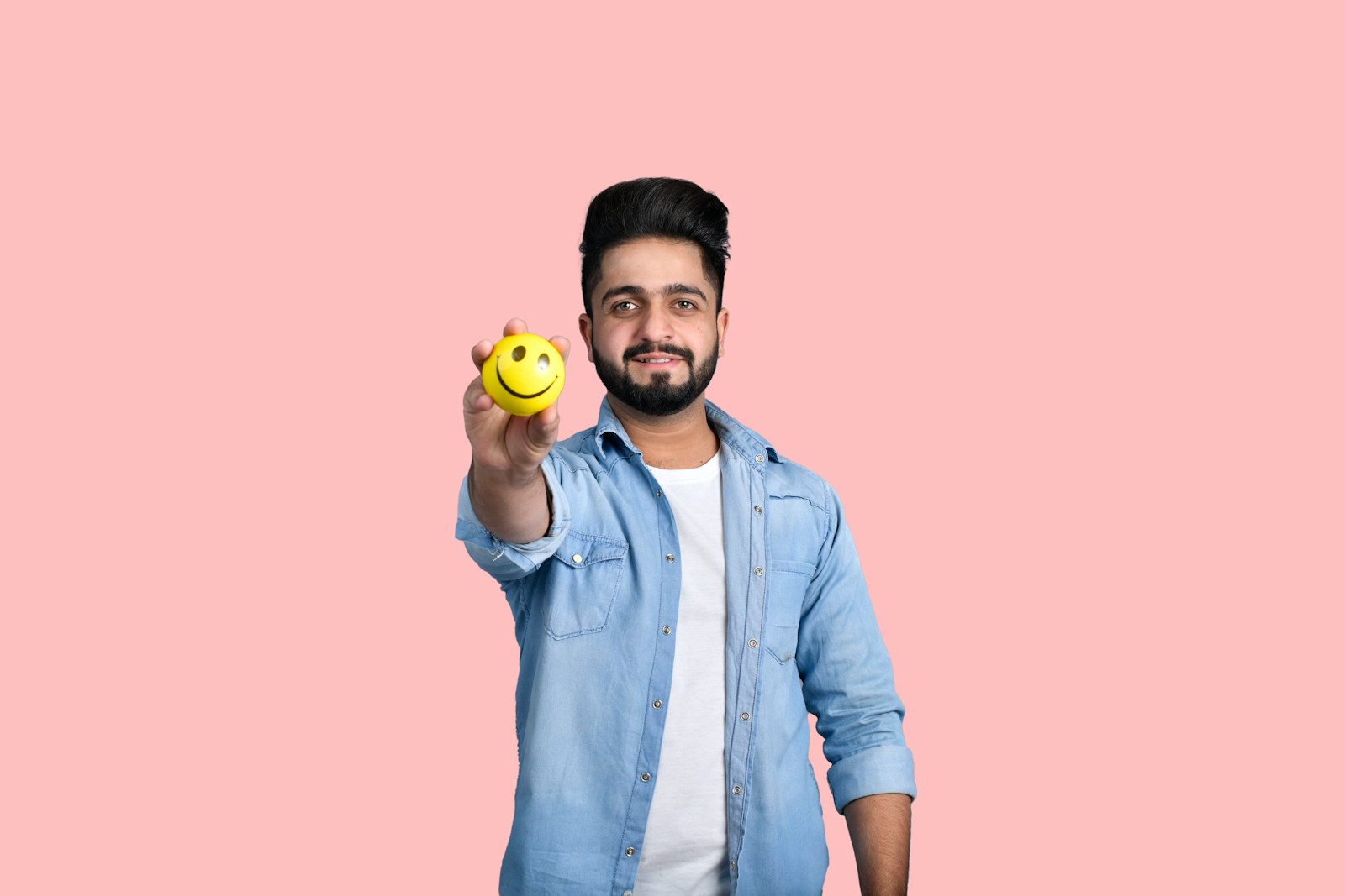 a man holding a ball