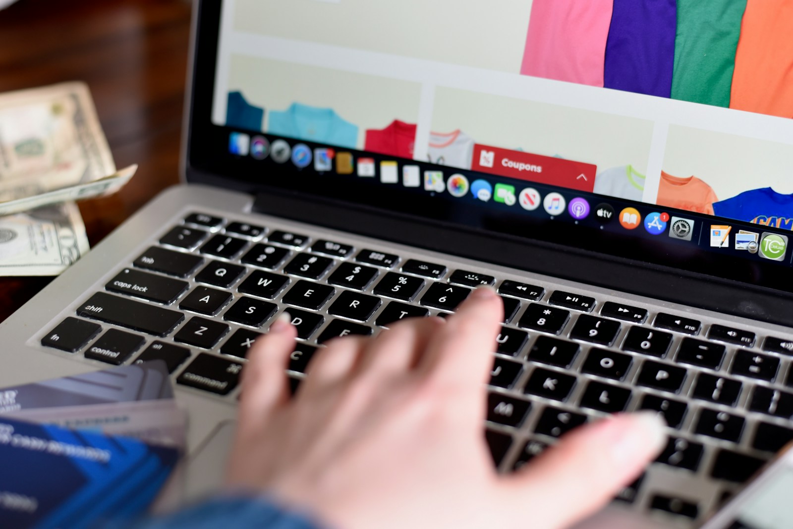 person using macbook pro turned on displaying game application