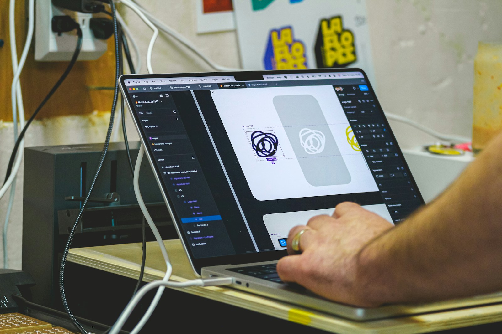 Person designing on a laptop computer screen.