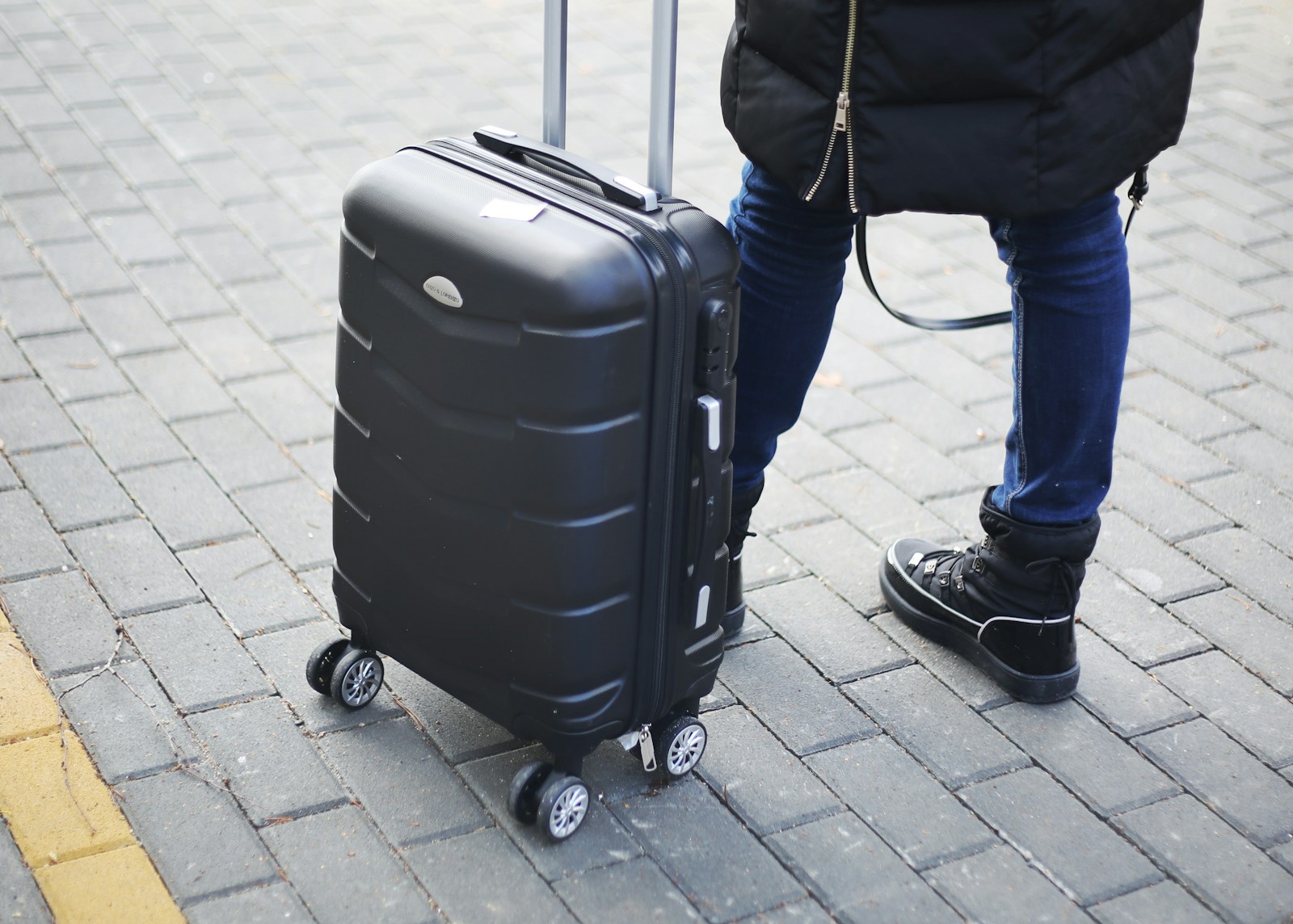 a person pulling a suitcase